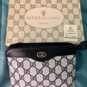 Gucci cosmetic bag 7”x5”x2-1/2. Like new.